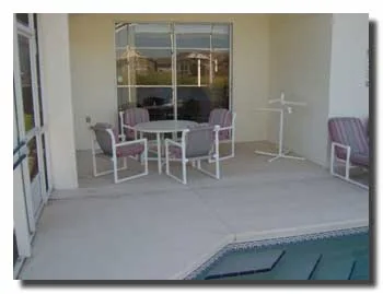 View of the lanai and pool deck looking over the lake